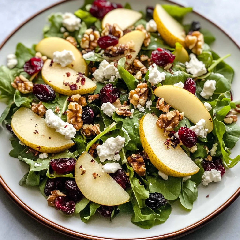 Pear walnut salad with cranberries and goat cheese